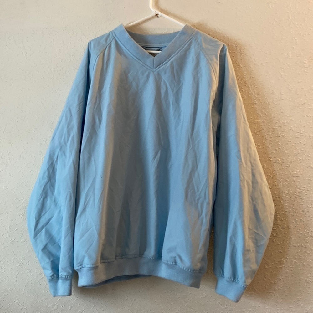 A men’s size extra-large, consensus, golf pull over T21